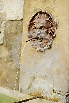 Old drinking water fountain of the famous Pitigliano town, located atop a volcanic tufa ridge. Beautiful italian towns and