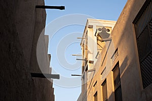 Old Dubai buildings and traditional Arabian street. Historical Al Fahidi neighbourhood, Al Bastakiya. Heritage district in United