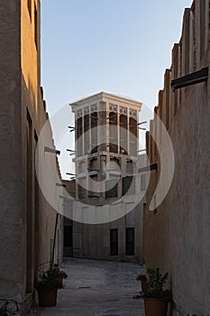 Old Dubai buildings and traditional Arabian street. Historical Al Fahidi neighbourhood, Al Bastakiya. Heritage district in United