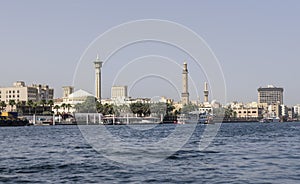 Old Dubai, viewed from the creek, with ancient mosques, along the river bank.
