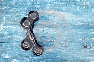 Old dumbbells on blue background