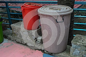 Old dustbin on the park at the roadside