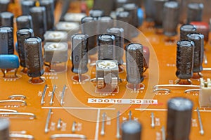 old dusty circuit board with electronic components close-up