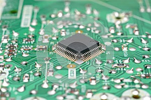 old dusty circuit board with electronic components close-up