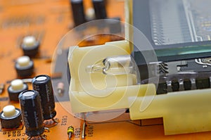 old dusty circuit board with electronic components close-up