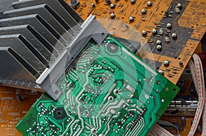 old dusty circuit board with electronic components close-up