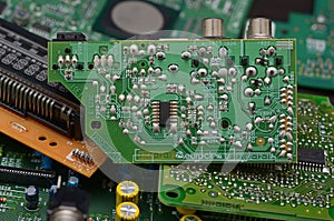 old dusty circuit board with electronic components close-up