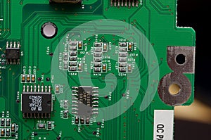 old dusty circuit board with electronic components close-up