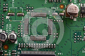 old dusty circuit board with electronic components close-up