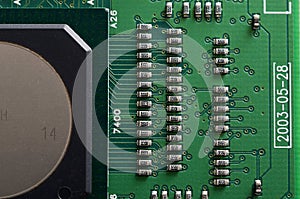 old dusty circuit board with electronic components close-up