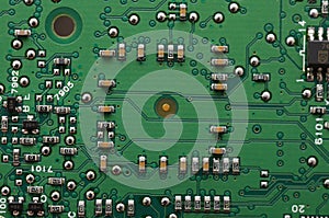 old dusty circuit board with electronic components close-up