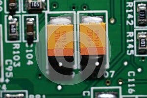 old dusty circuit board with electronic components close-up