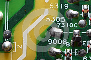 old dusty circuit board with electronic components close-up