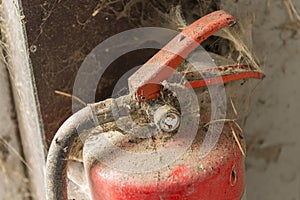 Old dusty fire extinguisher