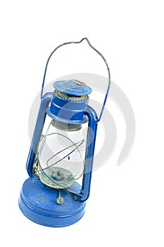 Old dusty kerosene oil lamp in blue