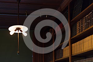 Old dusty light bulb glowing in the dark