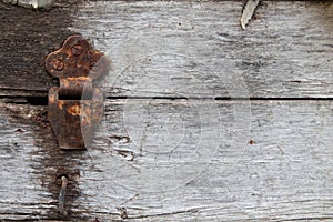 Old dusty rustic hinge on hinge box on grunge texture background. Antique Wooden Chest