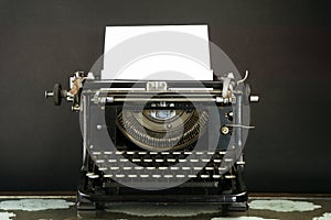 Old and Dusty Typewriter with a sheet of paper