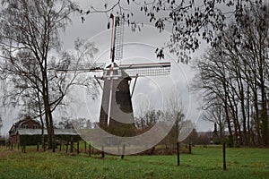 Old Dutch mill in winter landscape