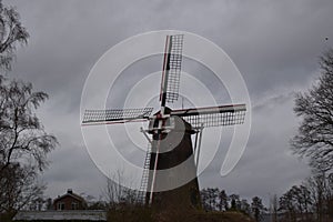 Old Dutch mill in winter landscape