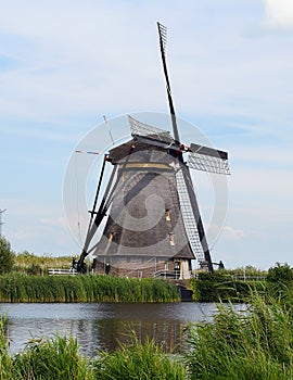 Old Dutch windmill on canal