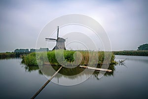 Old dutch windmill in cold morning scenery
