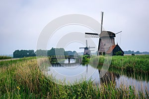 Old dutch windmill in cold morning scenery near Amsterdam