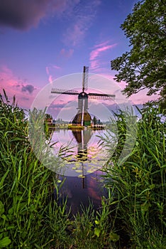 Old dutch windmill at sunset in Kinderdijk