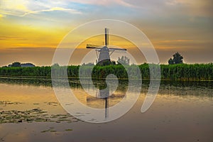 Old dutch windmill at sunset in Kinderdijk, Netherlands