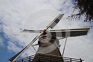 Old dutch windmill in villagye named Oldebroek with name De Hoop, still working as peel and as grind mill.