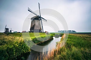 Old dutch windmills in cold morning scenery near Amsterdam