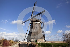 The old Dutch windmills, Holland, rural expanses . Windmills, the symbol of Holland.