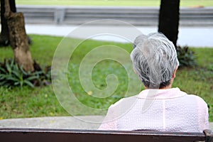 Old elder woman resting in garden. elderly female relaxing outdoors. senior leisure lifestyle