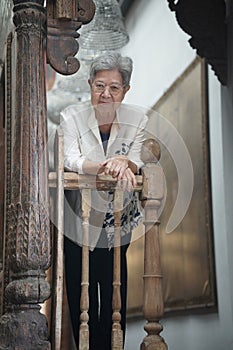 old elderly elder senior woman resting relaxing on terrace balcony