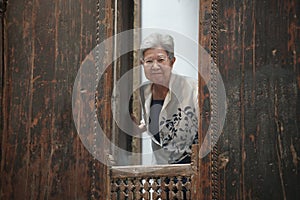 old elderly elder senior woman smiling at window