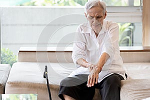 Old elderly patient suffer from gout,rheumatoid,chronic arthritis with severe pain,injury wrist bones,Asian senior woman is