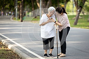 Old elderly with short of breath and chest pain from heart disease, heart attack or heart failure while walking to exercise in