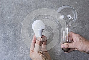 Old electric bulb with ecologic led one. Save energy concept