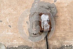 Old electric control box on the concrete wall