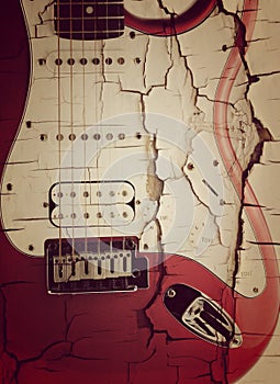 Old electric guitar on white