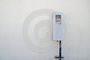 Old electric meter on a wall