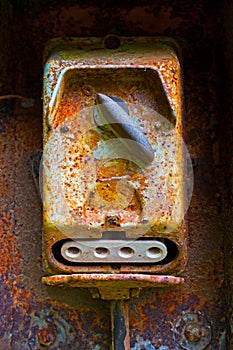 Old electric switch on rusty iron wall