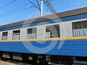 Electric train cars at the ground station in perspective against the background of the sky