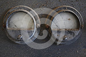 Old electrical measuring instruments in abandoned place voltmeter amperemeter