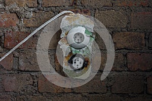 The old electrical outlet on decrepit wall, lost places