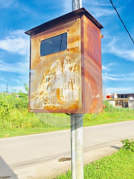 Old electrical panel box on power pole