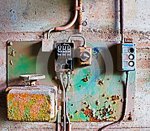 Old electrical panel on concrete wall