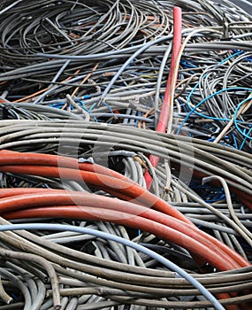 Old electrical wires in landfill for recycling copper and plastic