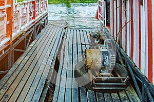 The old electricity generator for floating wooden raft house