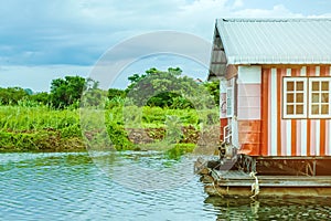 The old electricity generator for floating wooden raft house